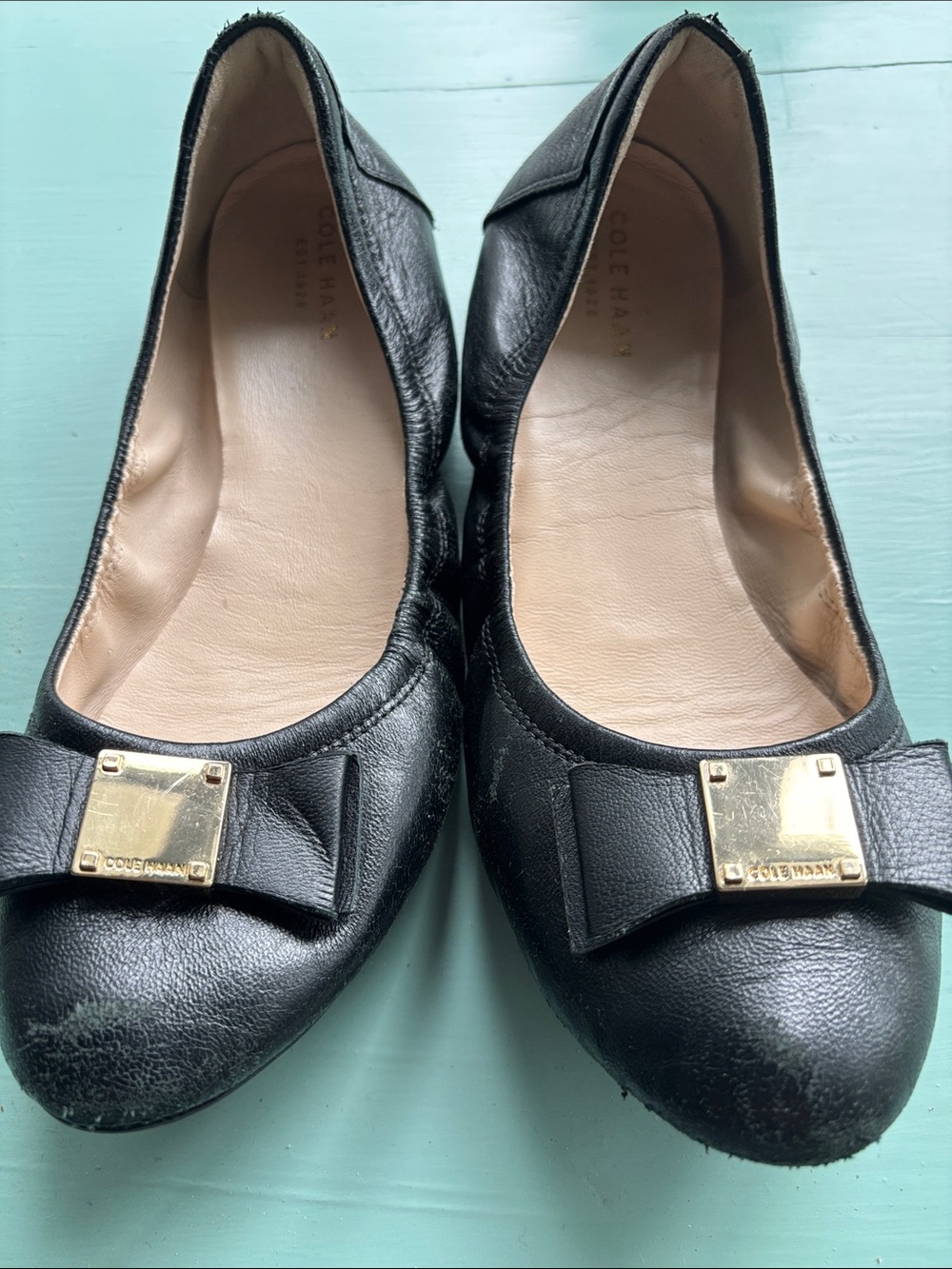 Cole Haan Black Leather Bow Flats with Gold Plaque
